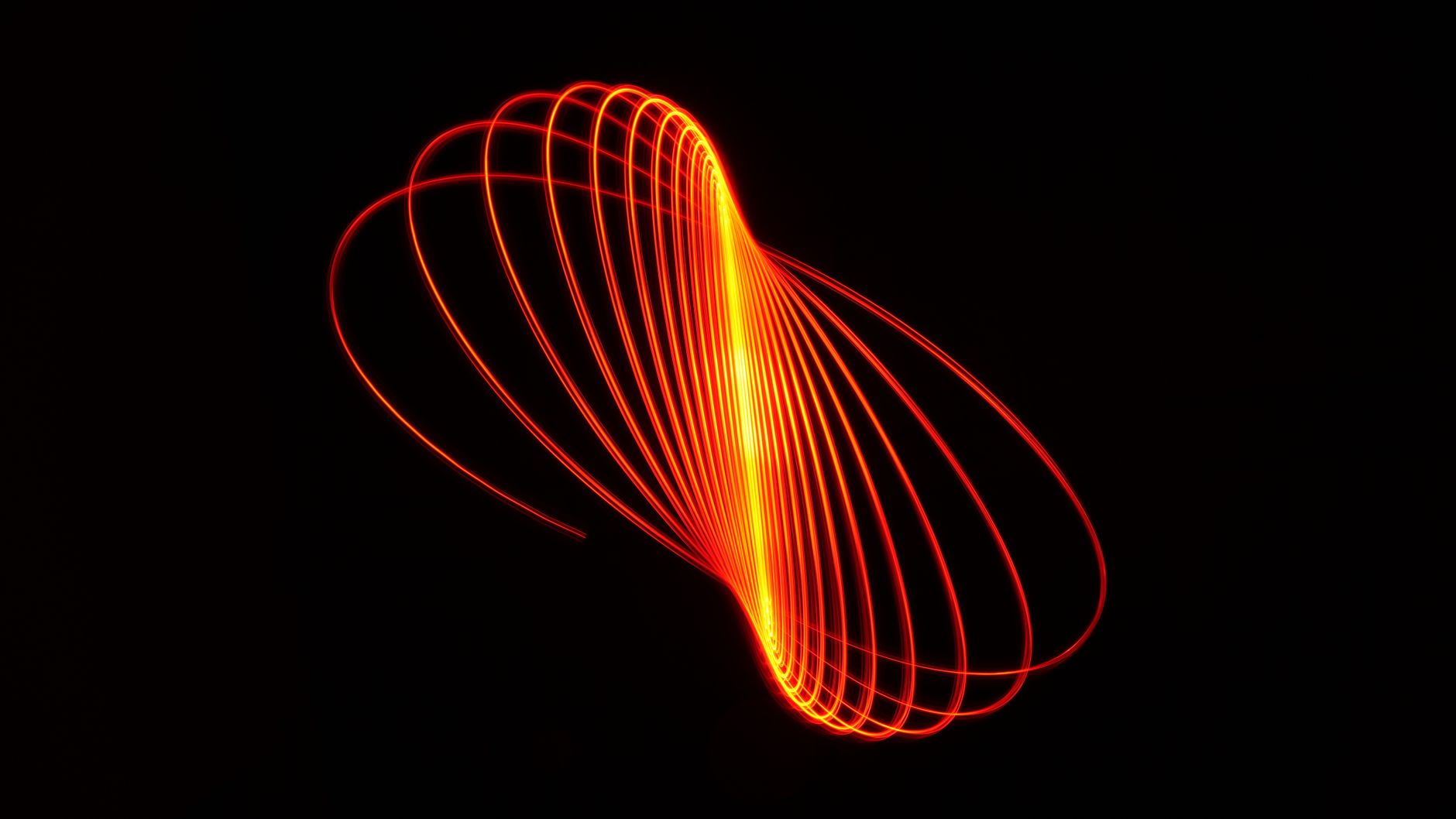 Red light tracing an arc against darkness